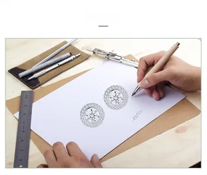 Macro view of a compass design sketch for s925 silver jewelry with professional tools