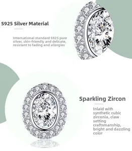 Close-up of S925 sterling silver oval earrings with sparkling zirconia in prong setting