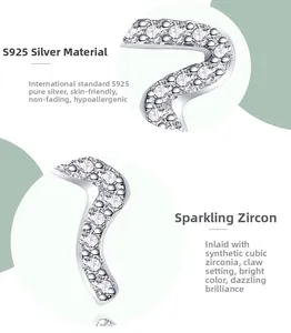 Detailed macro view of S925 sterling silver snake earring with claw-set cubic zirconia