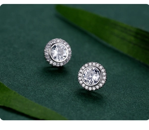 Macro view of S925 sterling silver halo stud earrings with round cubic zirconia
