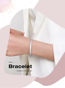 Detail of luxury S925 silver bracelet with sparkling pavé cubic zirconia on model wrist