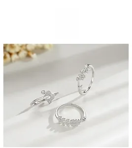 Detailed view of 925 sterling silver rings with leaf motifs and cubic zirconia stones
