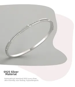 Macro detail of S925 sterling silver double-layer bangle with inlaid zircon stones