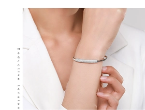 Detail of s925 silver bamboo style cuff bracelet with pavé cubic zirconia on model