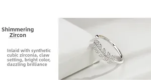 Macro detail of silver feather ring with hand-set pavé cubic zirconia accents