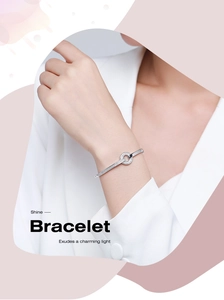 Detailed view of s925 silver bracelet with sparkling pavé crystal interlaced circles