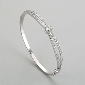 Bracelet jonc ouvert en argent sterling S925 avec nœud et zircons cubiques pavés