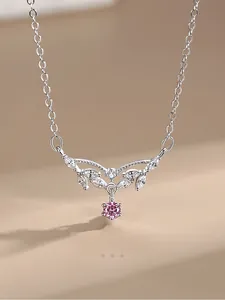 Macro detail of S925 silver necklace with leaf pendant and pink zircon stone