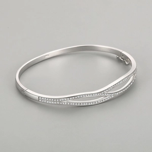 Double-layered crossed S925 silver bangle featuring sparkling pavé zircon stones