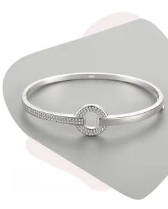 Macro detail of S925 sterling silver stamp and micro-pave cubic zirconia on open bangle