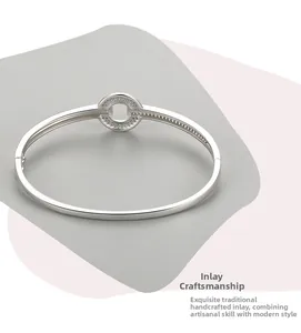 Detailed view of s925 silver bracelet featuring a circular inlaid zirconia craft design