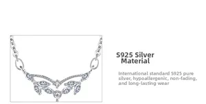Macro detail of S925 sterling silver V-shape pendant with marquise-cut zircons