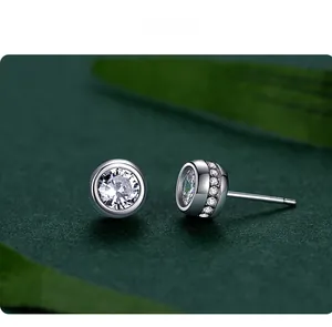 Detailed macro view of S925 sterling silver bubble stud earrings with cubic zirconia