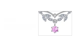 Macro detail of leaf-shaped silver necklace with marquise gems and pink pendant