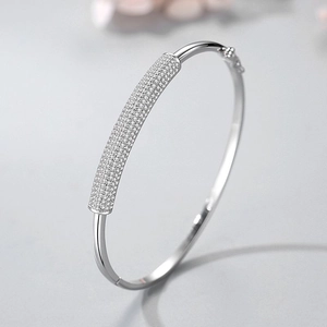 Elegant s925 silver bamboo-style open bangle featuring shimmering pave-set cubic zirconia
