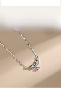 Detail of S925 silver necklace featuring a leaf pendant with pink zircon and white stones