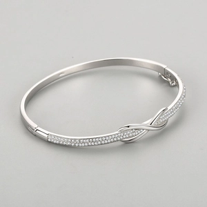 S925 silver infinity bangle featuring sparkling pavé cubic zirconia and bow design