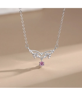 Detail of silver S925 necklace with pink zircon drop and crystal leaf pendant