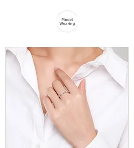 Close-up of s925 silver wavy ring with inlaid cubic zirconia on a model's finger