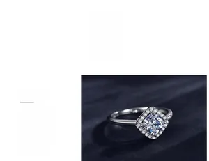 Detail of 925 silver ring featuring a square cut center stone and triple-layer polished finish