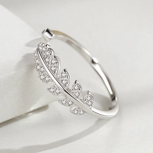 Polished 925 sterling silver open ring featuring a crystal-encrusted leaf motif