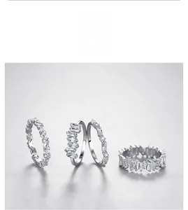 Detailed view of four S925 sterling silver rings with baguette and round cut zircon stones