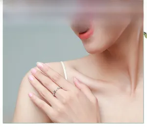 Close-up of S925 sterling silver chain ring with pavé cubic zirconia on a model's finger