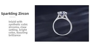Detailed view of 6-prong set 2ct cubic zirconia ring with side pavé stones on silver band