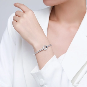 Elegant s925 silver bangle with a geometric circle and diamond inlay on a female wrist