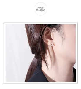Close-up of model wearing S925 silver hollow hoop earrings with micro-set zircons