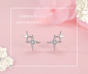 Close-up of S925 sterling silver four-point star earrings with zircon inlay detail