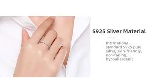 Detailed close-up of S925 sterling silver ring with irregular zircon wave design