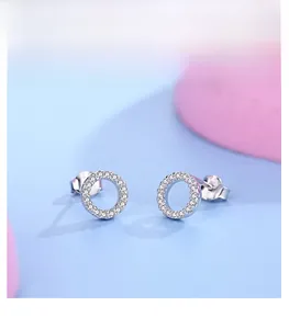 Macro shot of S925 sterling silver hollow hoop earrings with paved cubic zirconia stones