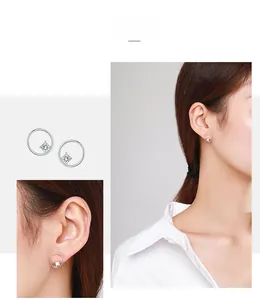 Detailed close-up of S925 sterling silver circle studs with square-cut cubic zirconia