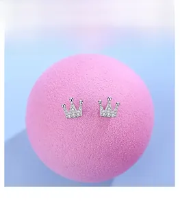 Close-up of S925 sterling silver crown stud earrings with shimmering zircon stones