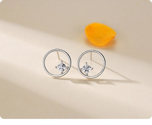 Close-up of S925 sterling silver hoop earrings with a square-cut sparkling zircon stone