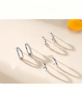 Three-pair set of 925 sterling silver C-shaped stud earrings with zircons and textures