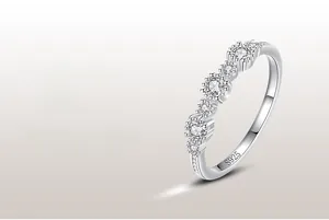 Detailed macro view showing the S925 hallmark and sparkling round diamonds on silver ring