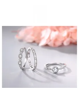 Detail of s925 silver ring set featuring a round cubic zirconia and pavé band accents