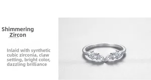Macro detail of V-shaped S925 sterling silver ring with marquise-cut cubic zirconia stones