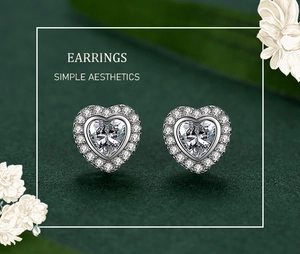 Macro view of S925 sterling silver heart halo stud earrings with sparkling cubic zirconia