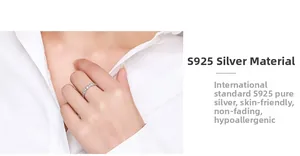 Close-up of a S925 sterling silver beaded ring on a woman finger wearing a white shirt