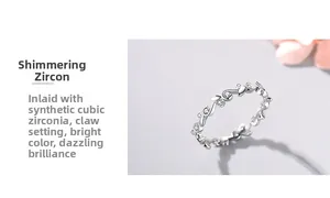 Detail of s925 silver flower ring showing prong-set cubic zirconia in a leaf-shaped band