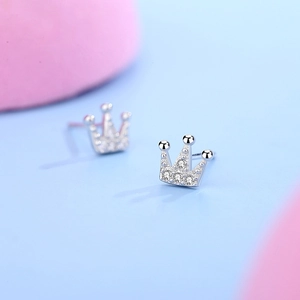 Sparkling S925 silver crown stud earrings with cubic zirconia stones on soft pastel background