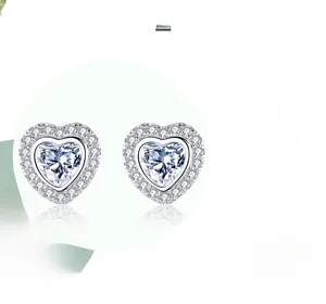 Macro shot of S925 sterling silver heart earrings with double halo zircon setting
