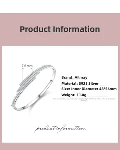 Detail of S925 sterling silver open bangle featuring a three-row diamond setting