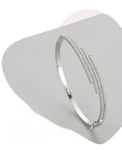 Detail view of S925 silver bangle showing cubic zirconia inlay and high-polished finish