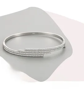 Detailed close-up of S925 sterling silver bangle with geometric zircon inlay setting