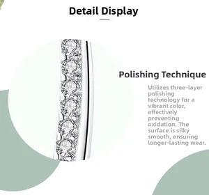 Macro detail of S925 silver stud earrings with sparkling diamonds and polished finish