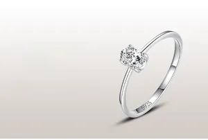 Detailed view of an oval-cut zircon stone in a 925 sterling silver four-prong setting